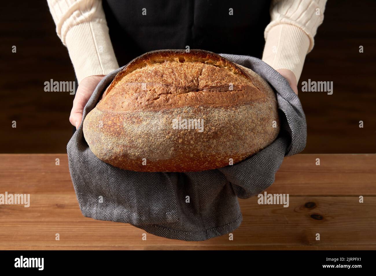 female baker with homemade bread at bakery Stock Photo Alamy