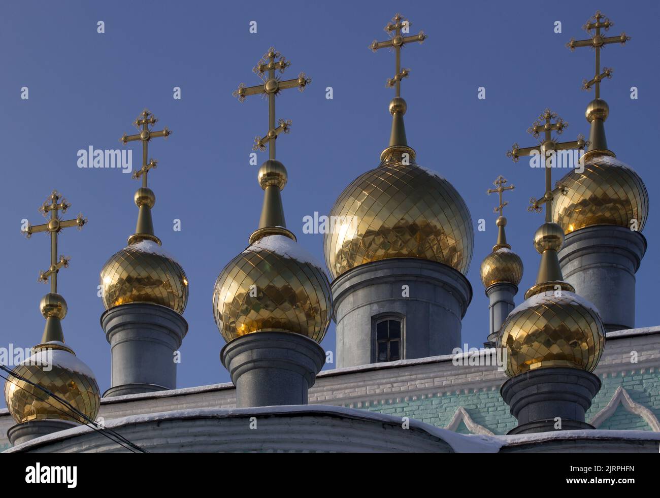 Golden gilt domes on Russian Orthodox church Stock Photo