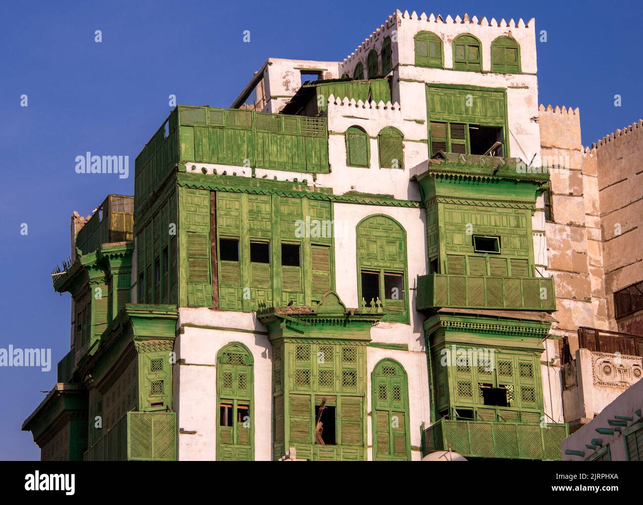 Restored green balconies Al Balad Jeddah Saudia Arabia1 Stock Photo