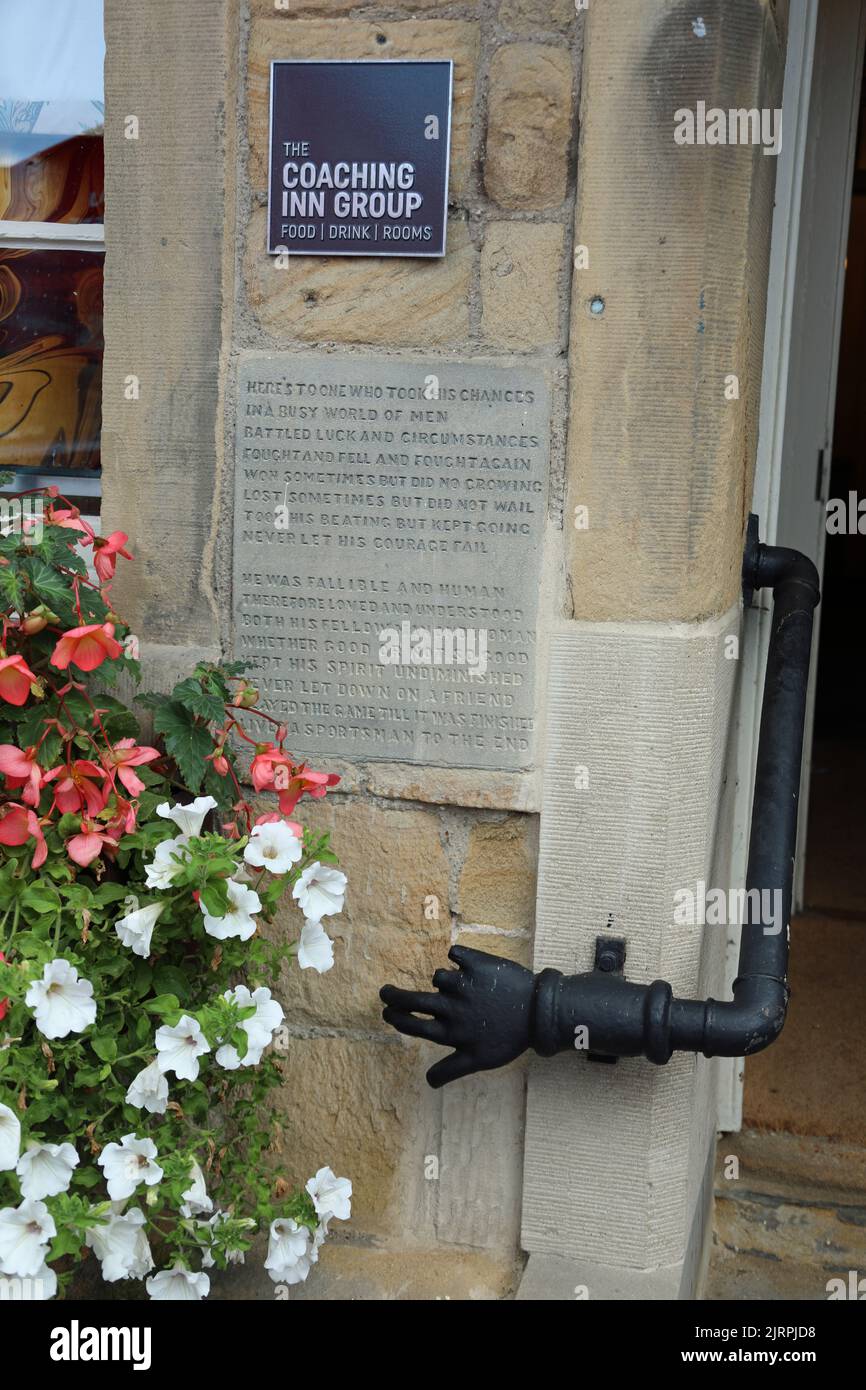 Two verses of a sportsmans poem installed at the side entrance of the famous Rutland Arms Hotel in Bakewell Stock Photo