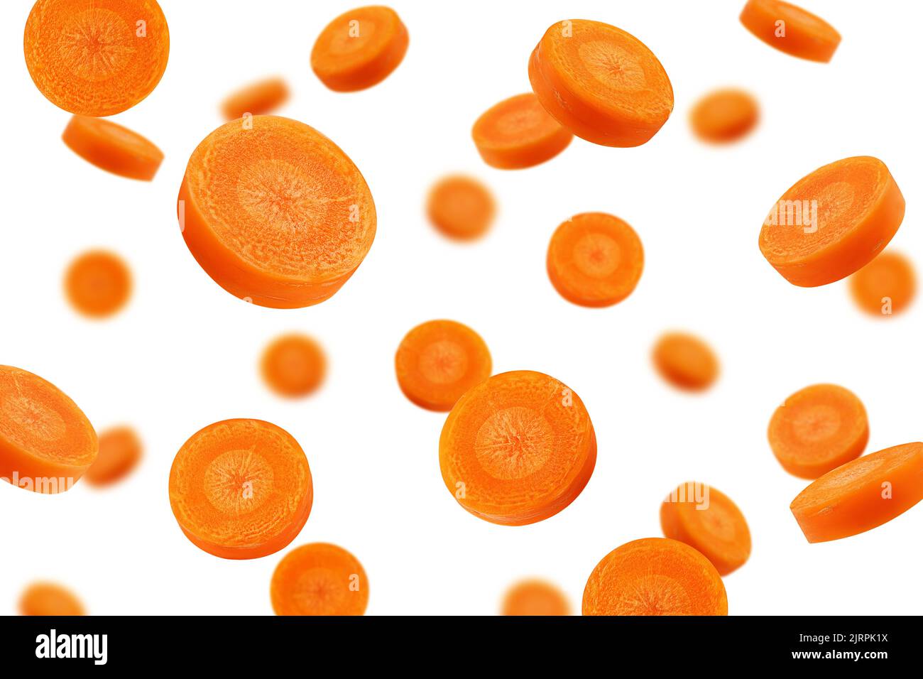 Falling Carrot slice isolated on white background, selective focus