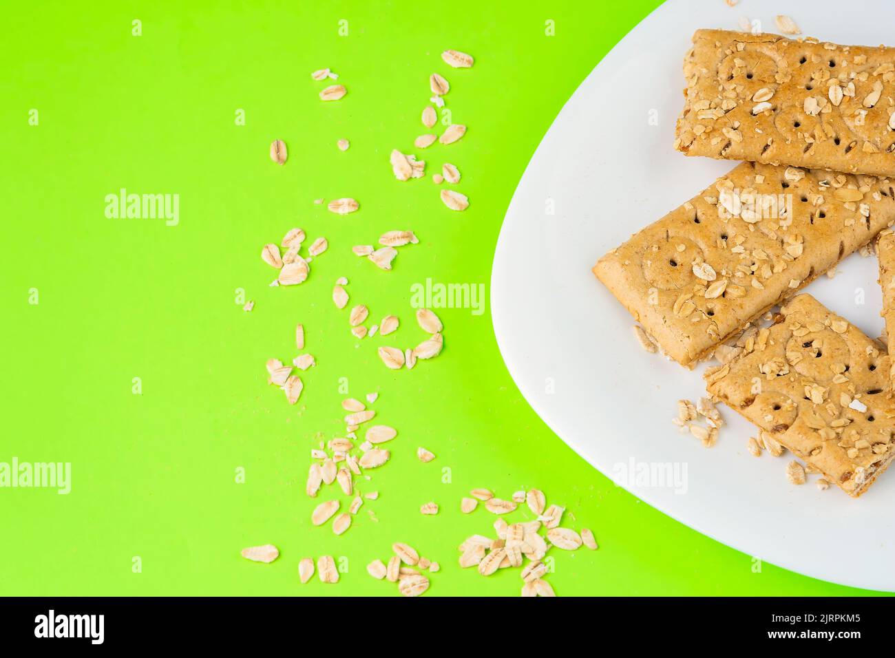 Oatmeal bar on a white plate, ready for breakfast copy space Stock Photo