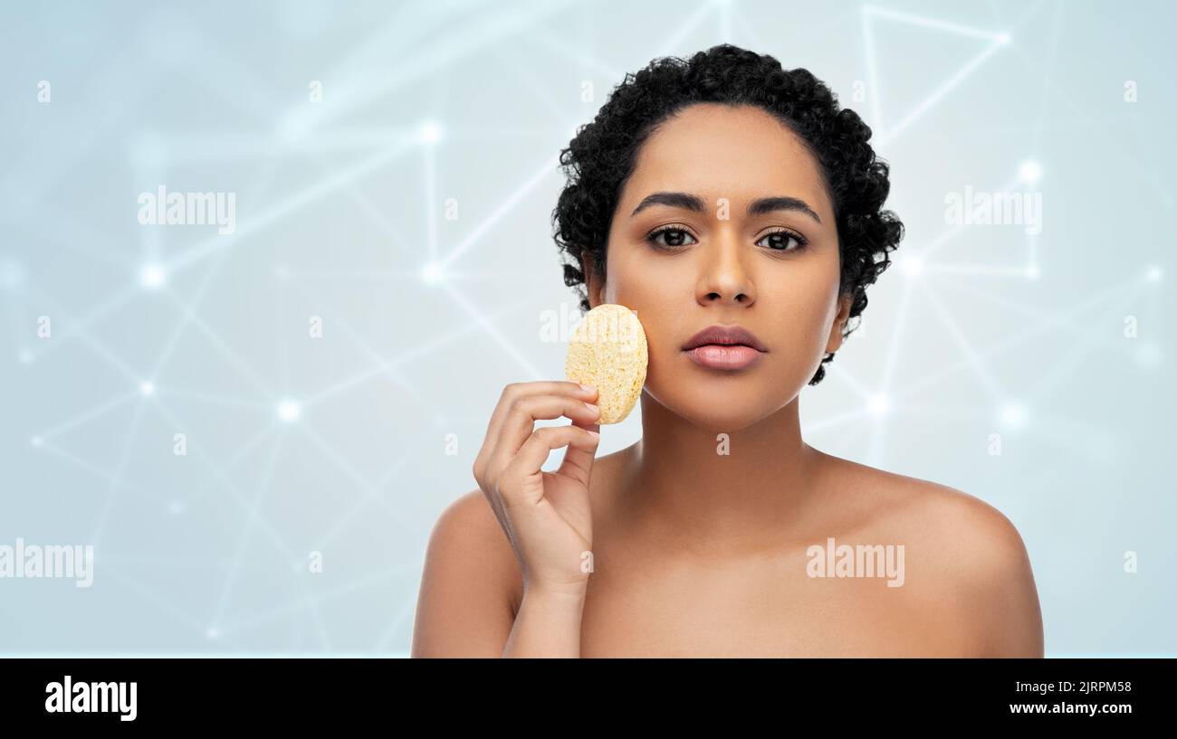 Black afro woman cleaning skin hi-res stock photography and images - Alamy