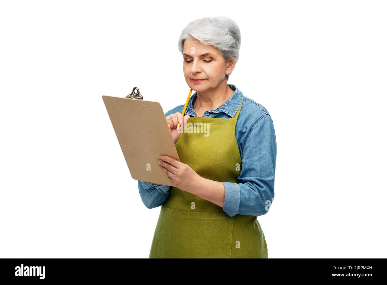 Pensive mature woman in apron hi-res stock photography and images - Alamy