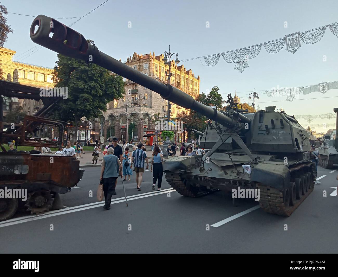 Destroyed military vehicle exhibition on Khreschatyk street on August 24, 2022 during Independence Day in Kiev, Ukraine. Visitors reviewed the broken and burned modern Russian armored cars, tanks etc. Stock Photo