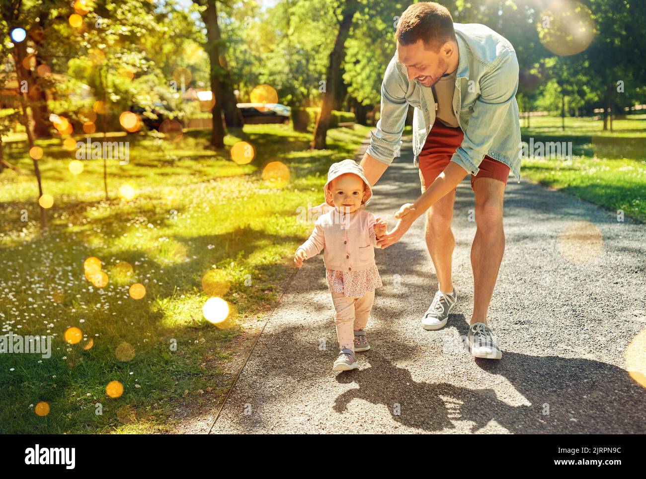 happy father with baby daughter walking at park Stock Photo - Alamy