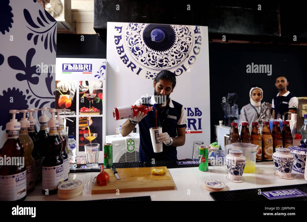 Amman, Jordan. 25th Aug, 2022. A barista prepares coffee for visitors