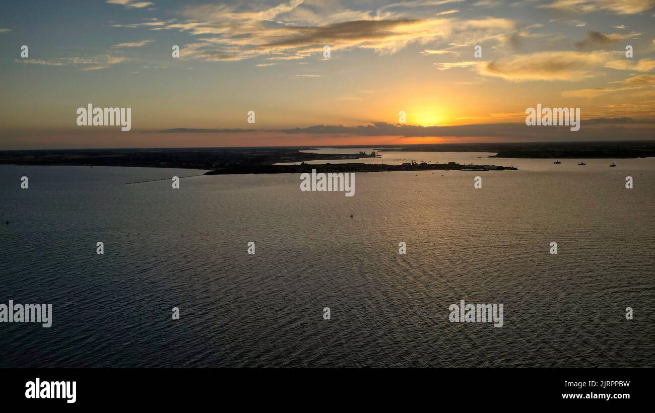 Sunset across the water of Harwich Harbour Stock Photo