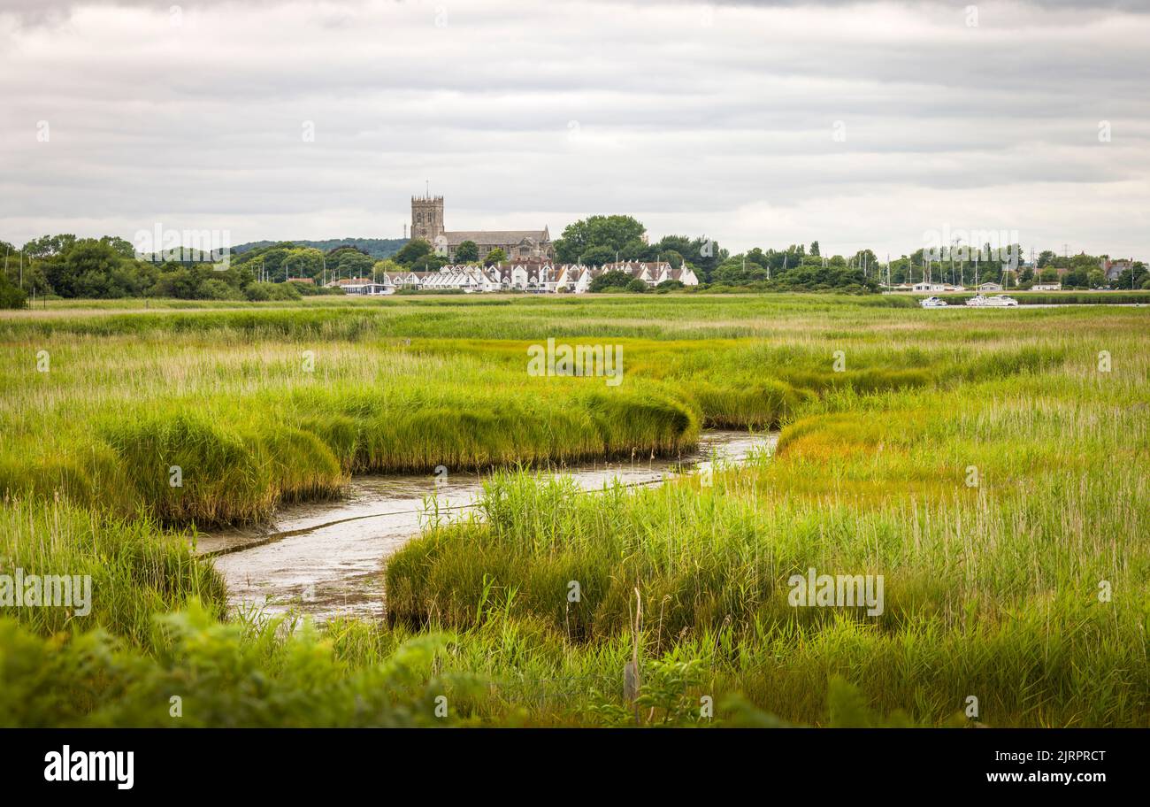 Hengistbury Head nature reserve wetlands with Christchurch Harbour and Priory in the background. Dorset, UK Stock Photo