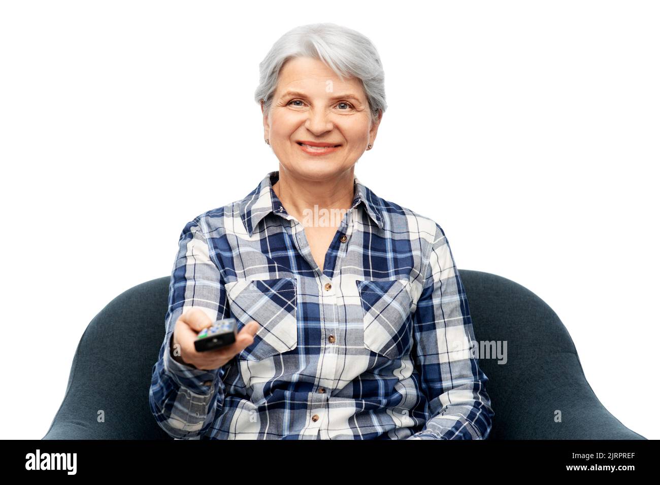 happy senior woman watching tv sitting in armchair Stock Photo Alamy