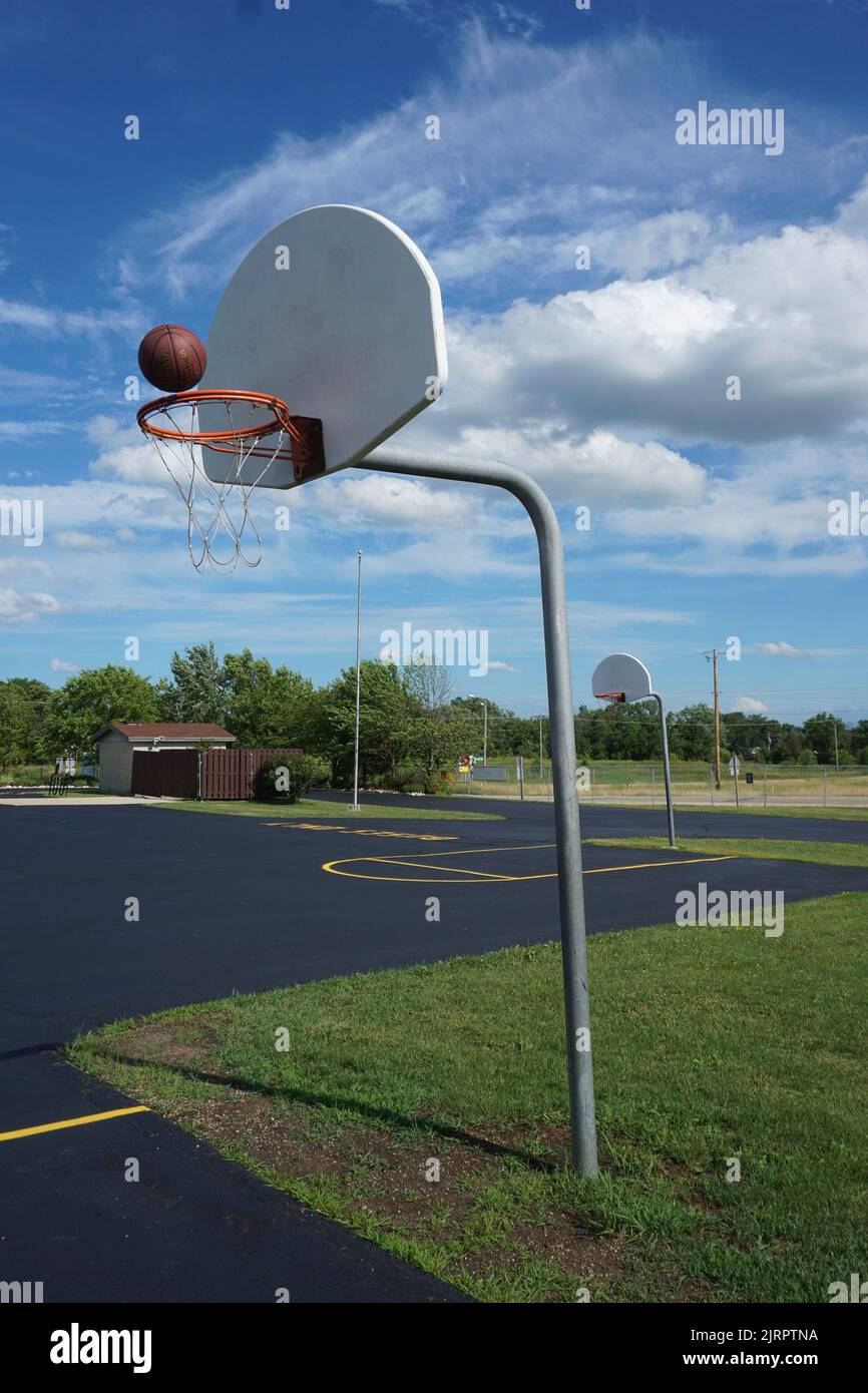 Basketball hoop at a grade school playground Stock Photo Alamy