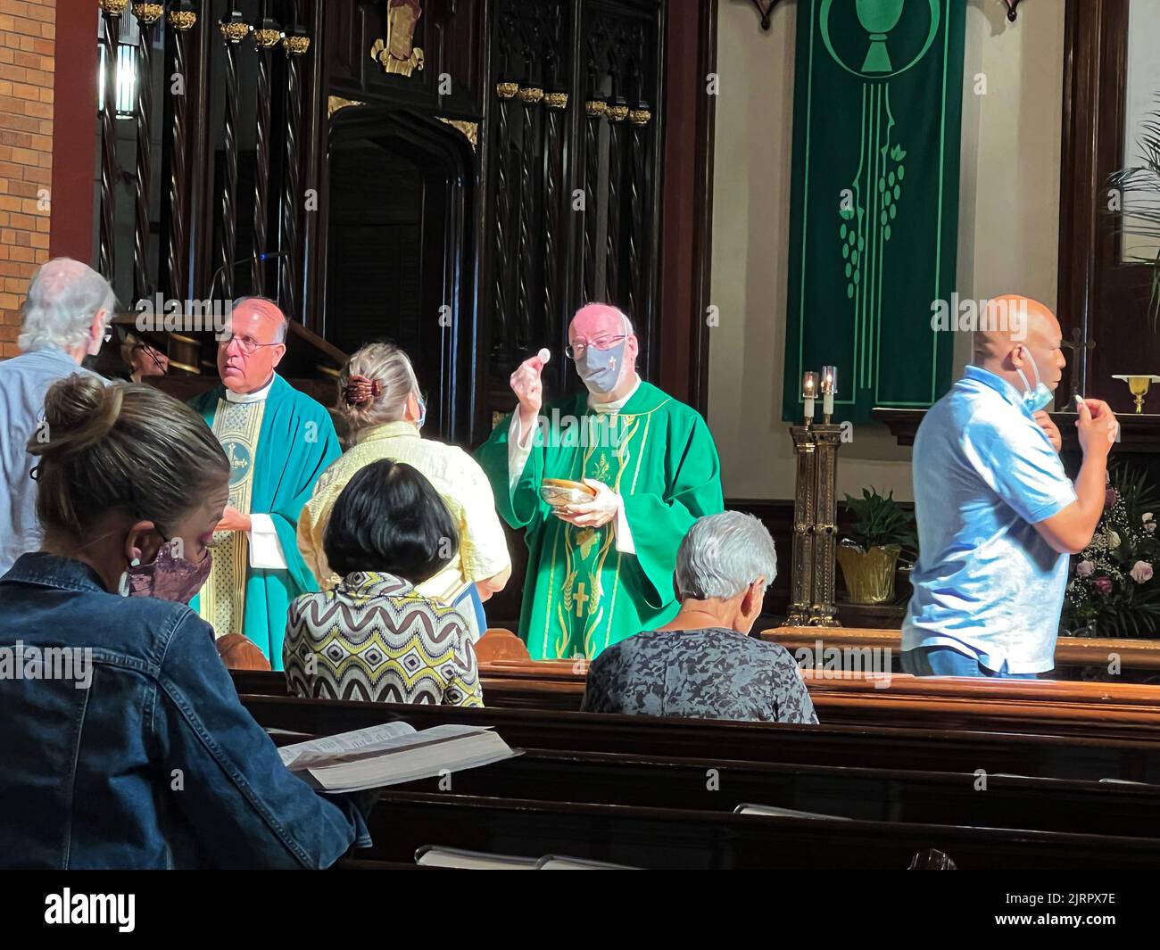 Priest offers Holy Communion during a Catholic Mass in Brooklyn, New