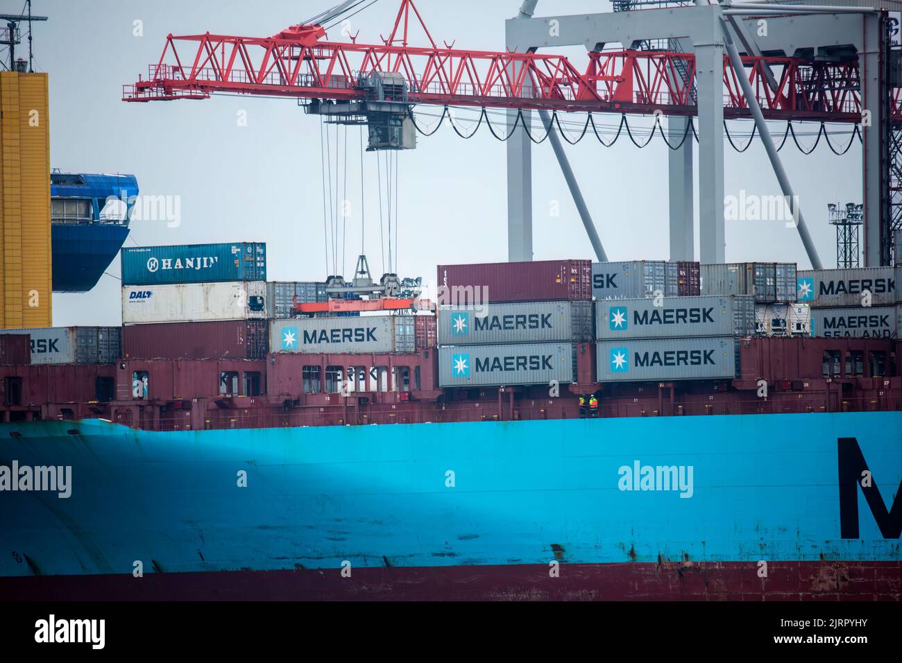 Container ship MAERSK in port at container terminal. Ships of container