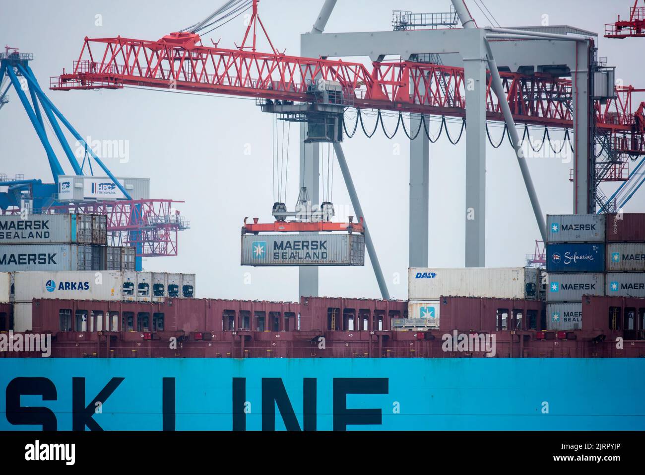 Container ship MAERSK in port at container terminal. Ships of container