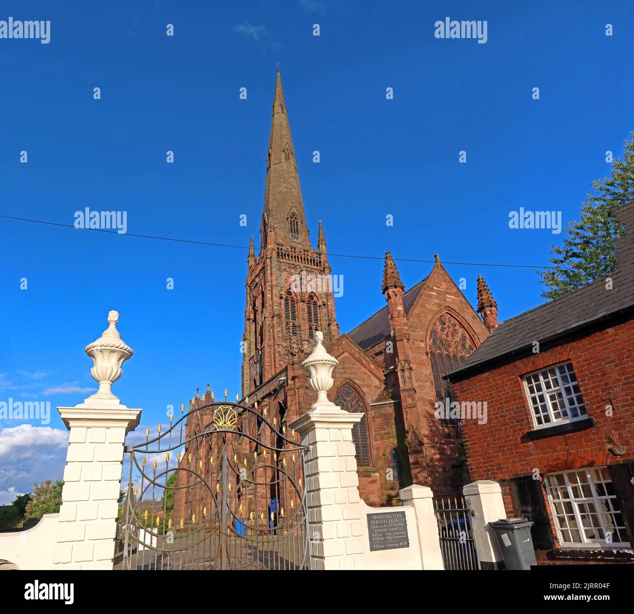 Gates and entrance to St Elphin's , blue skies, 129 Church Street, Warrington, Cheshire, England, UK , WA1 2TL Stock Photo