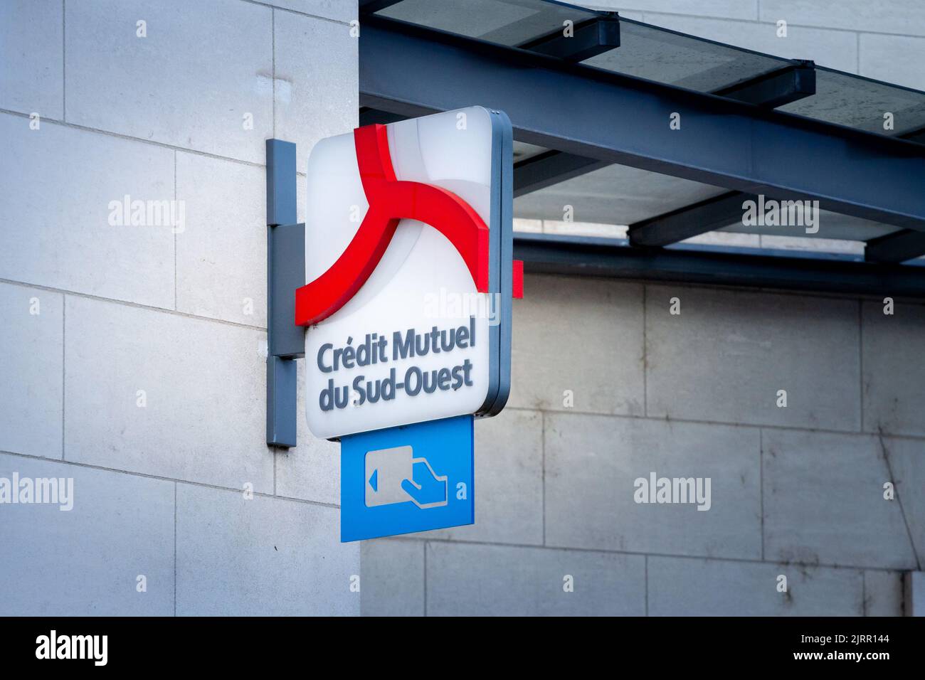 Picture of a sign with the logo of Credit Mutuel du sud ouest on their local banking agency for Bordeaux, France. Credit Mutuel Arkea is a French coop Stock Photo