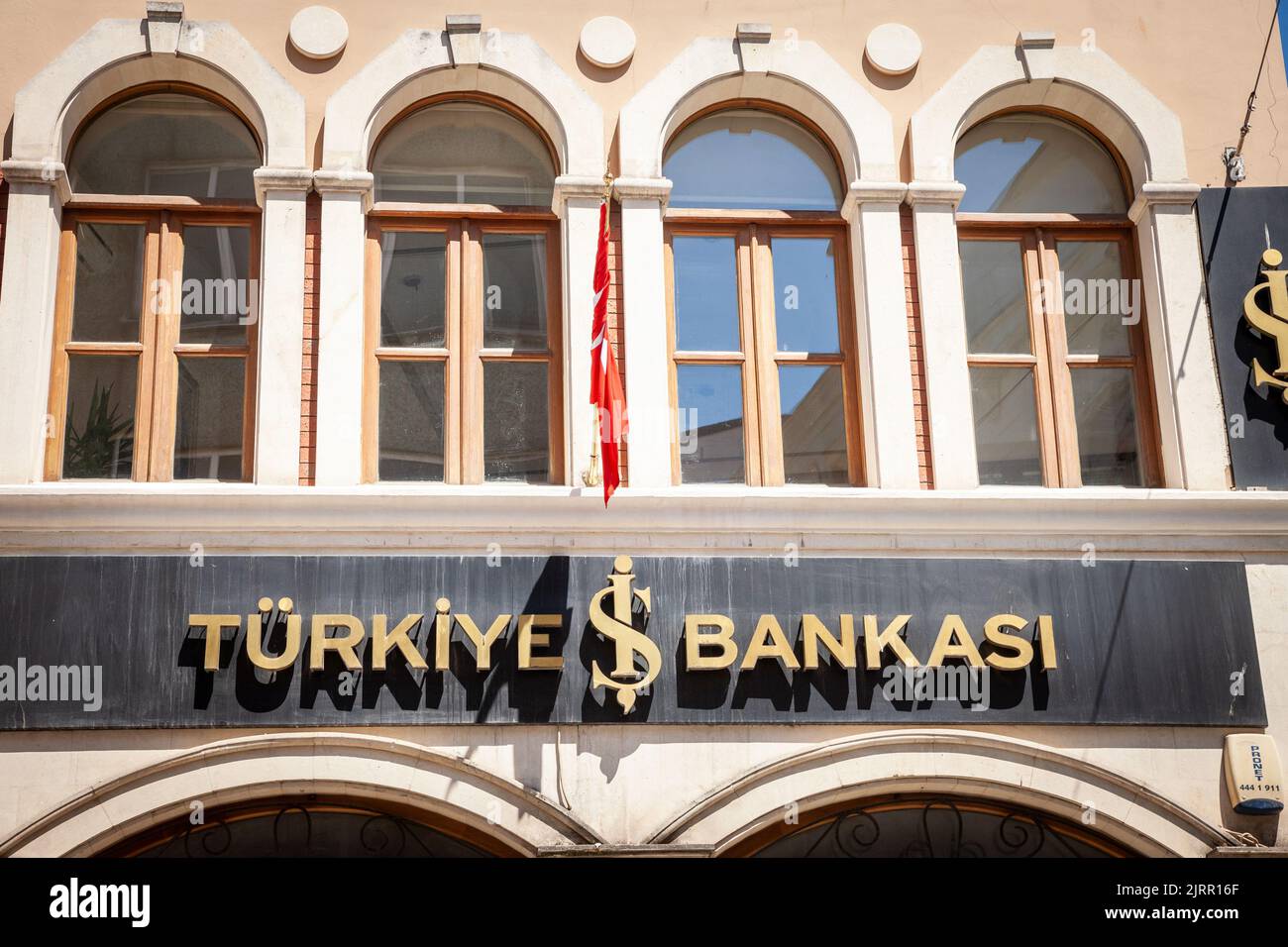 Picture of a sign with the logo of Turkiye IS Bankasi taken in front of their local bank in Istanbul, Turkey. Isbank, officially Turkiye Is Bankasi, i Stock Photo