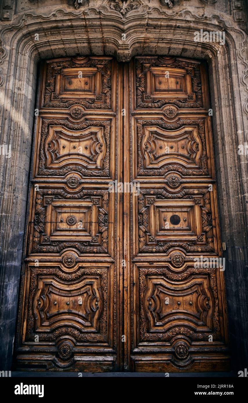 A vintage Massive wooden door with ornaments Stock Photo Alamy