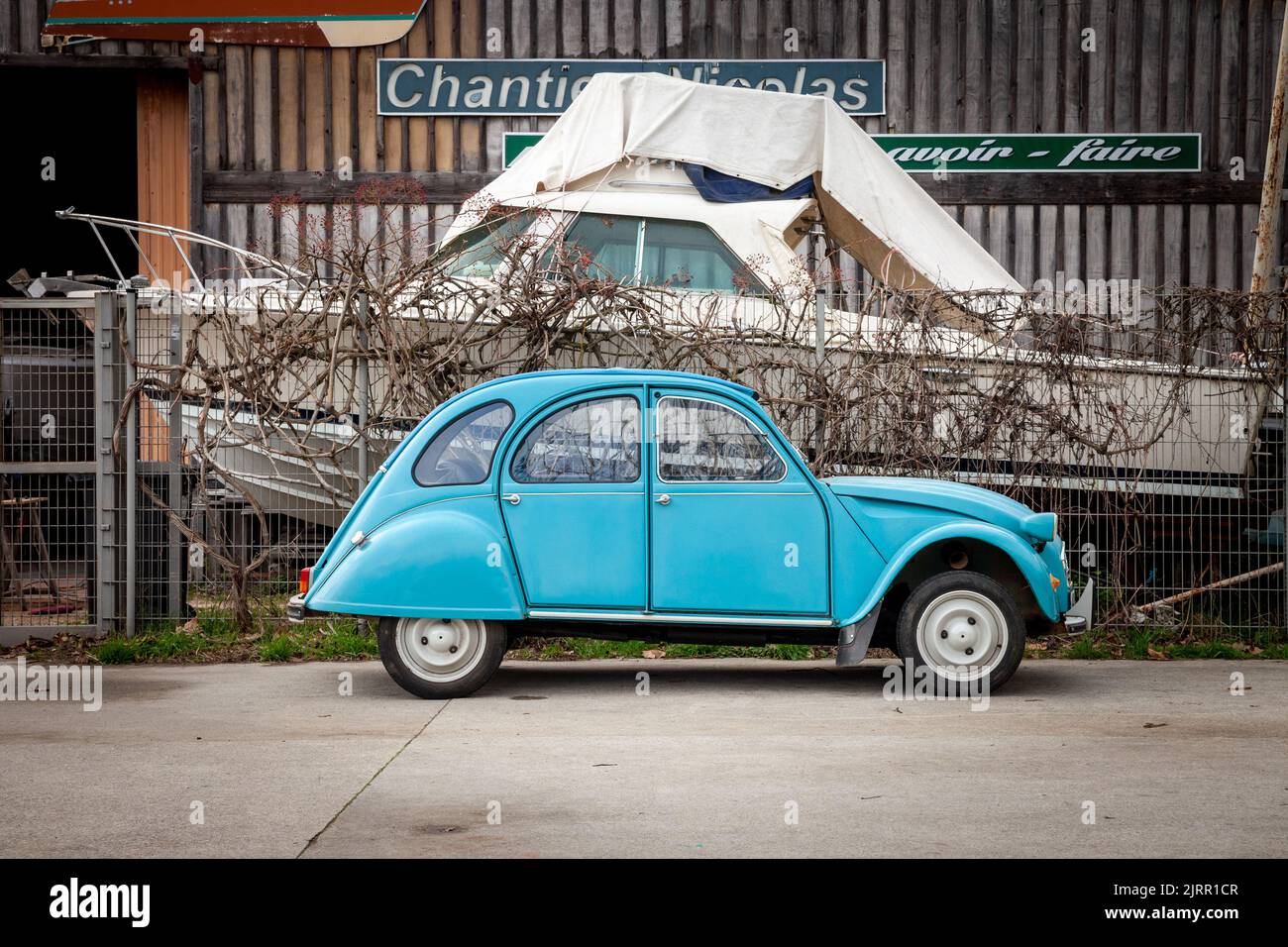 Picture of a citroen 2CV parked in the center of Bordeaux, France. The Citroën 2CV is an air-cooled front-engine, front-wheel-drive, economy family ca Stock Photo