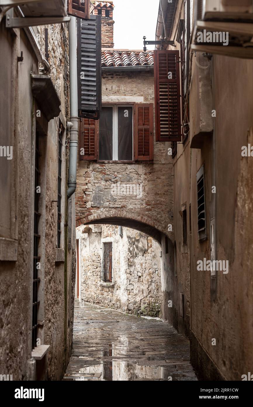 Picture of a narrow medieval street of the historical center of Piran Slovenia. Piran is a town in southwestern Slovenia on the Gulf of Piran on the A Stock Photo