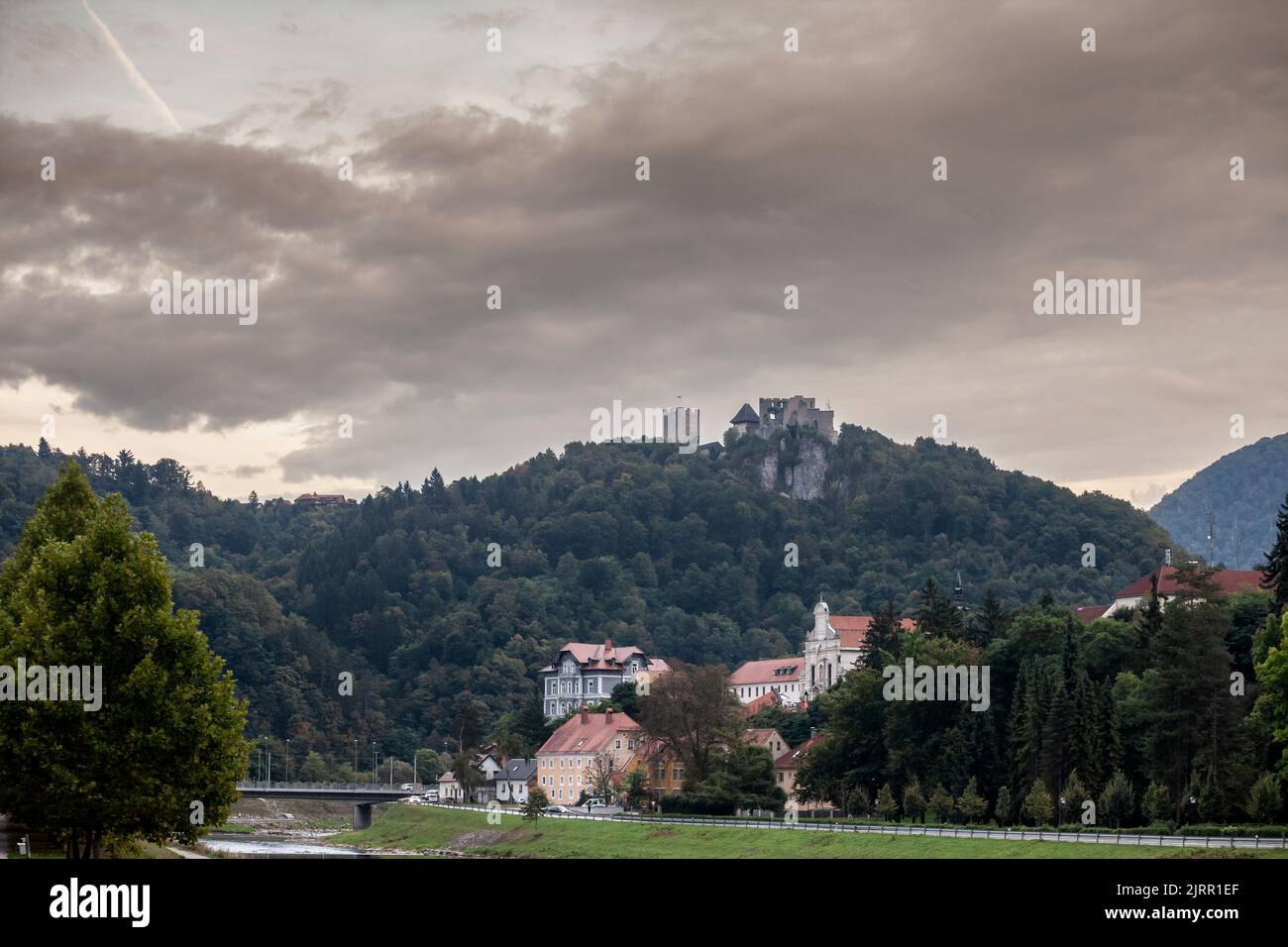 Picture of the landscape of riverbank of Savinja river with the celje castle in background. Celje is the fourth-largest city in Slovenia. It is a regi Stock Photo