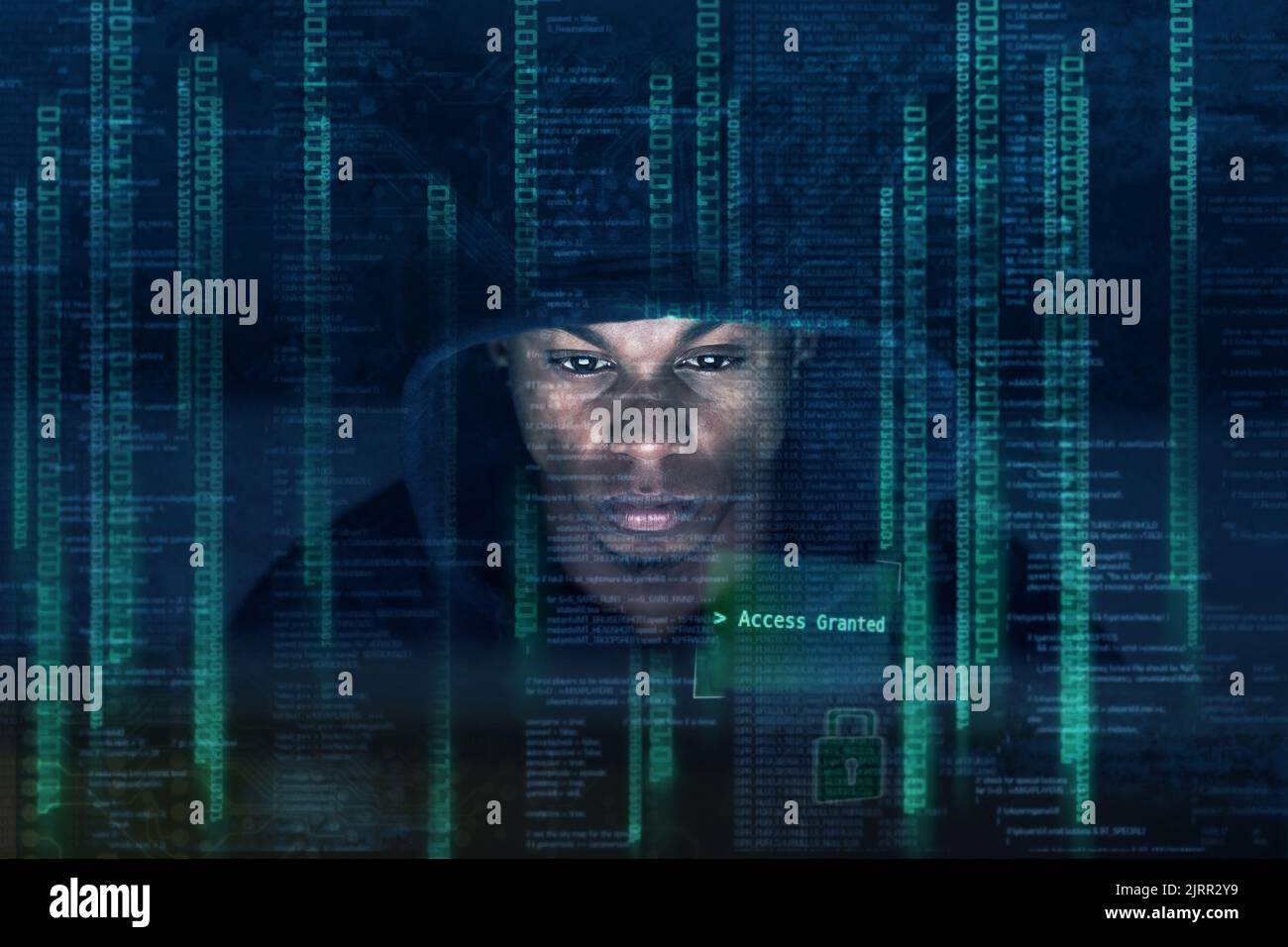 Theres not many who understand the matrix. a young man hacking into a secure computer network. Stock Photo