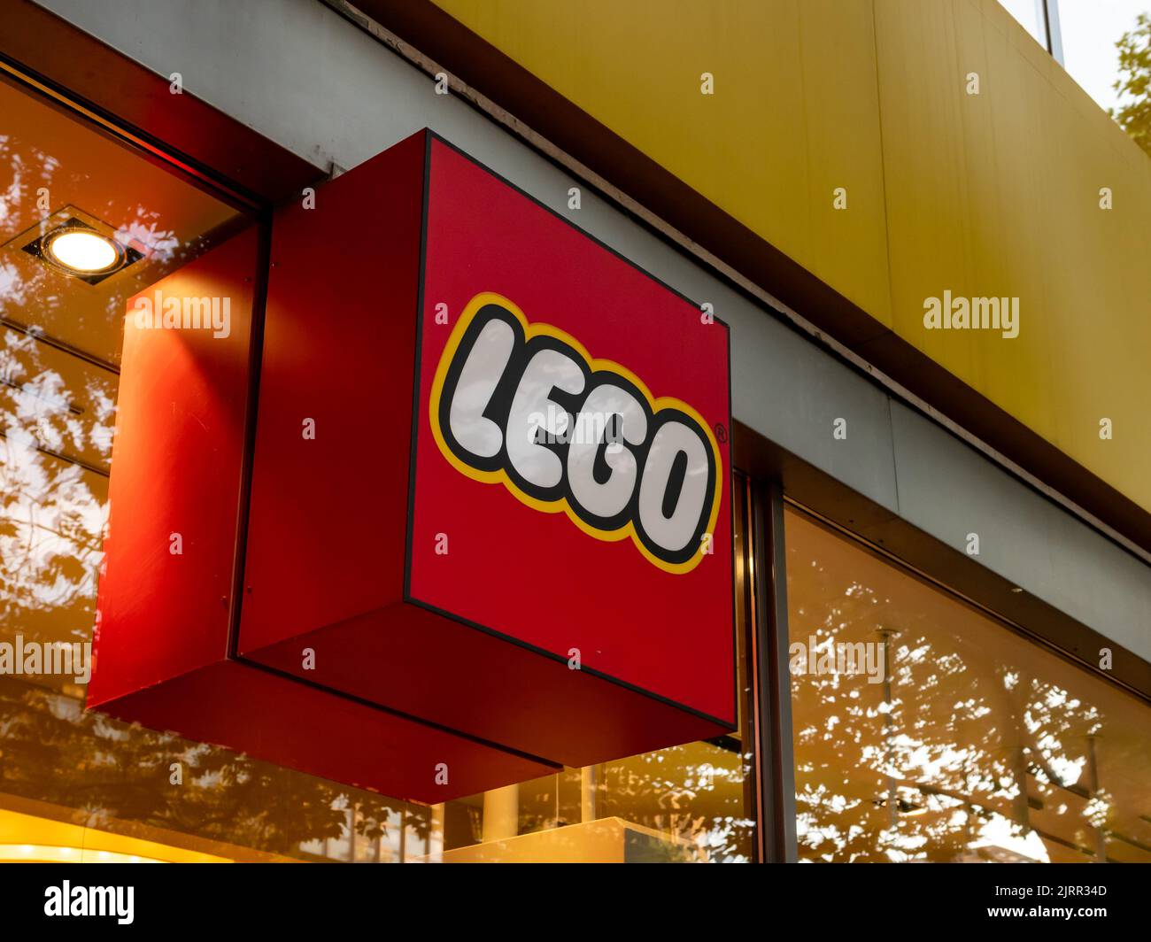 LEGO logo on the facade of a store in the city. Sign of the Danish manufacturer of plastic construction toys is famous for high quality products. Stock Photo
