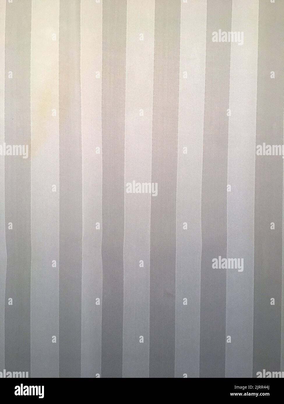 Vertical gray and white striped fabric textile background Stock Photo