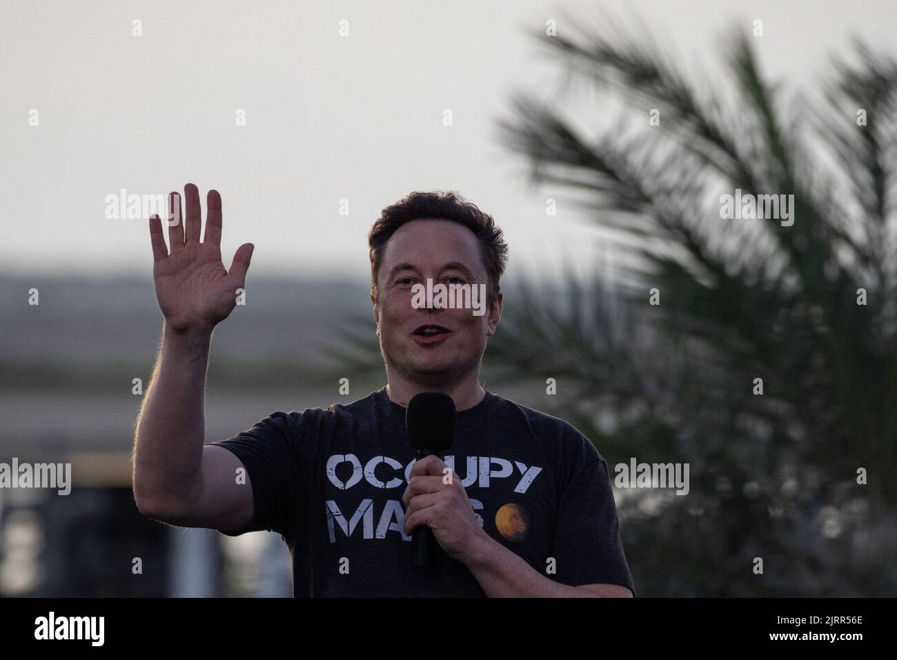SpaceX Chief Engineer Elon Musk gestures during a joint news conference with T-Mobile CEO Mike Sievert at the SpaceX Starbase, in Brownsville, Texas, U.S., August 25, 2022. REUTERS/Adrees Latif Stock Photo