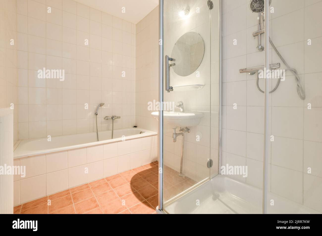 Modern home interior design of white bathroom with open bathtub and