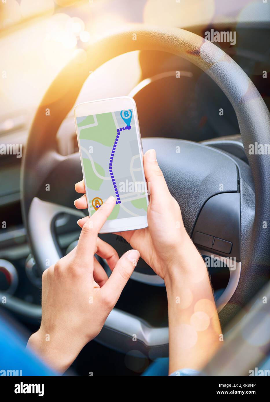 Preplanning her journey. a woman using her phones gps system while