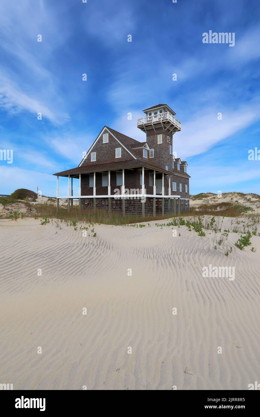 Historic Oregon Inlet life-saving station on Pea Island near Rodanthe, on the outer banks of North Carolina vertical Stock Photo