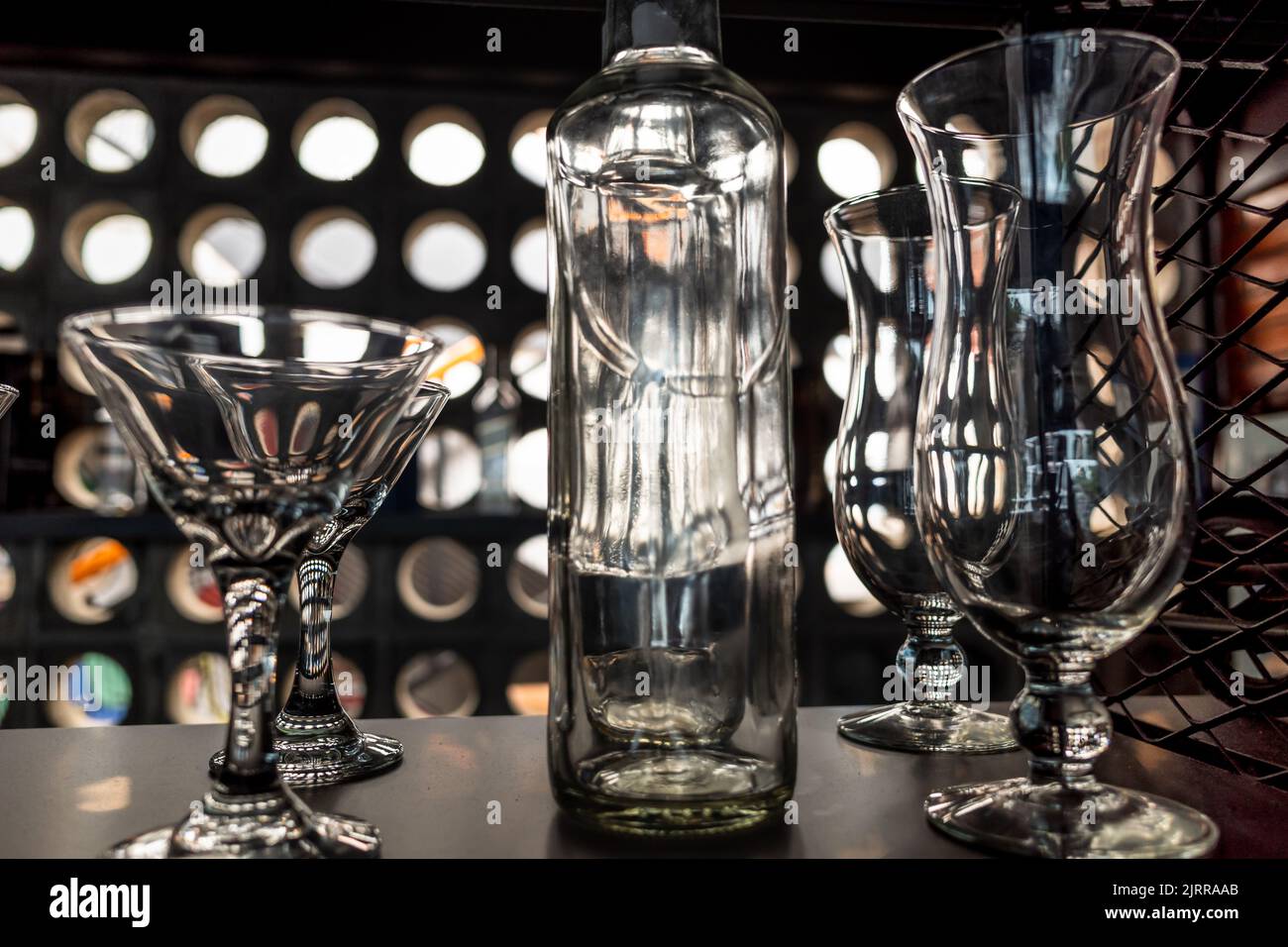 Clean Glass and Bottle Array Displayed on rack at a Café Stock Photo