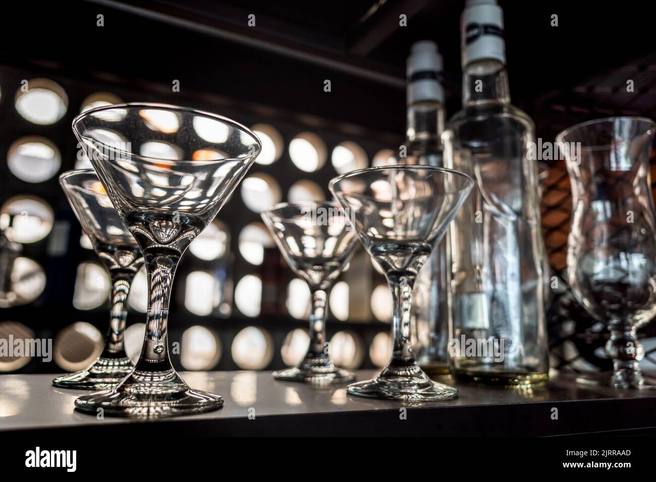 Clean Glass and Bottle Array Displayed on rack at a Café Stock Photo