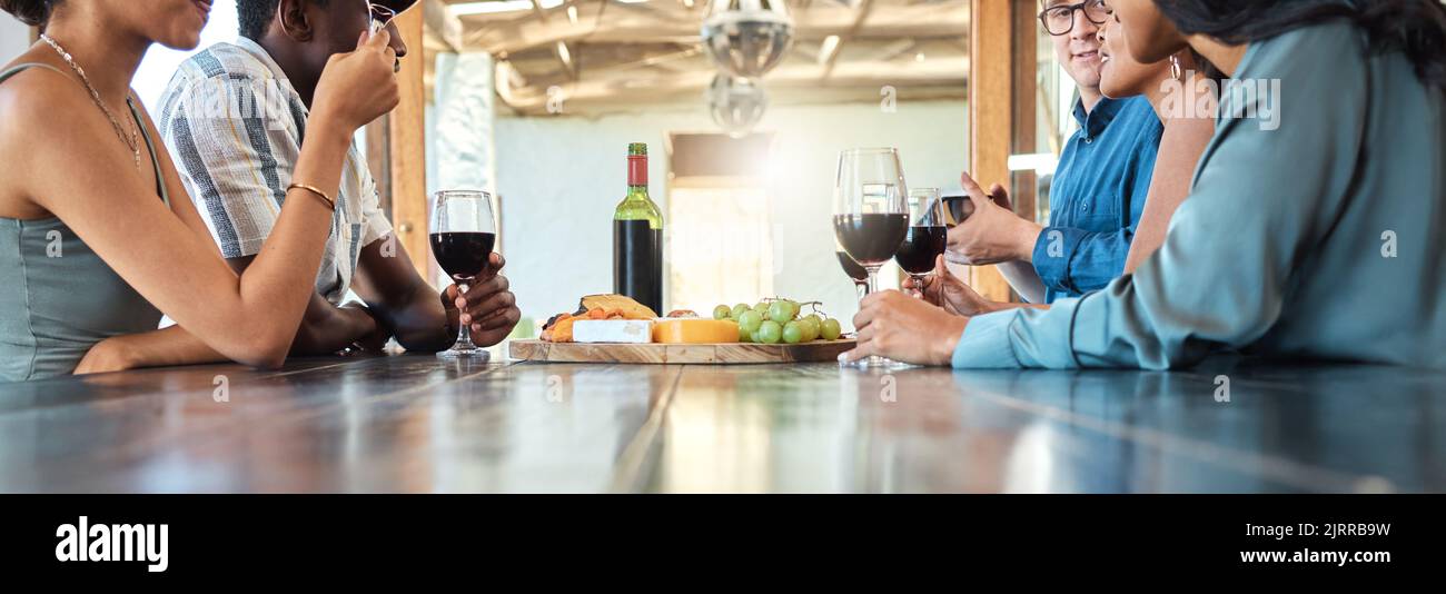 Wine tasting and cheese platter with friends at a restaurant or estate in the winery in the agriculture or sustainability industry. Drinking alcohol Stock Photo