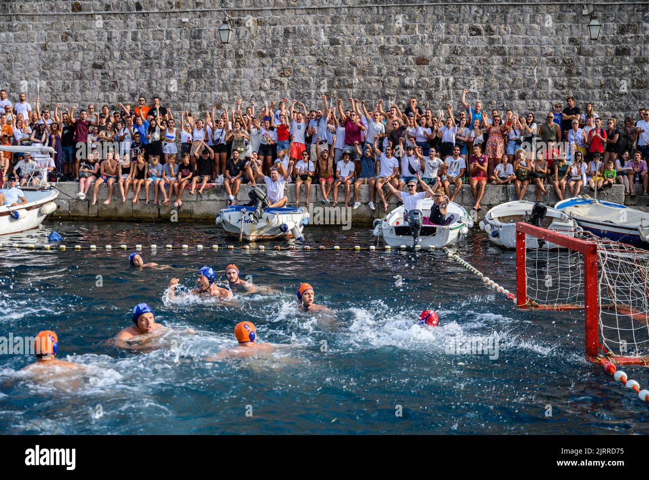 Dubrovnik, Croatia. 21st Aug, 2022. Water polo; Wild Waterpolo League, Final, Kokoti - FUN H2O in the port of the Old Town of Dubrovnik. Fans of the Kokoti team cheer after a goal. Credit: Robert Michael/dpa/Alamy Live News Stock Photo