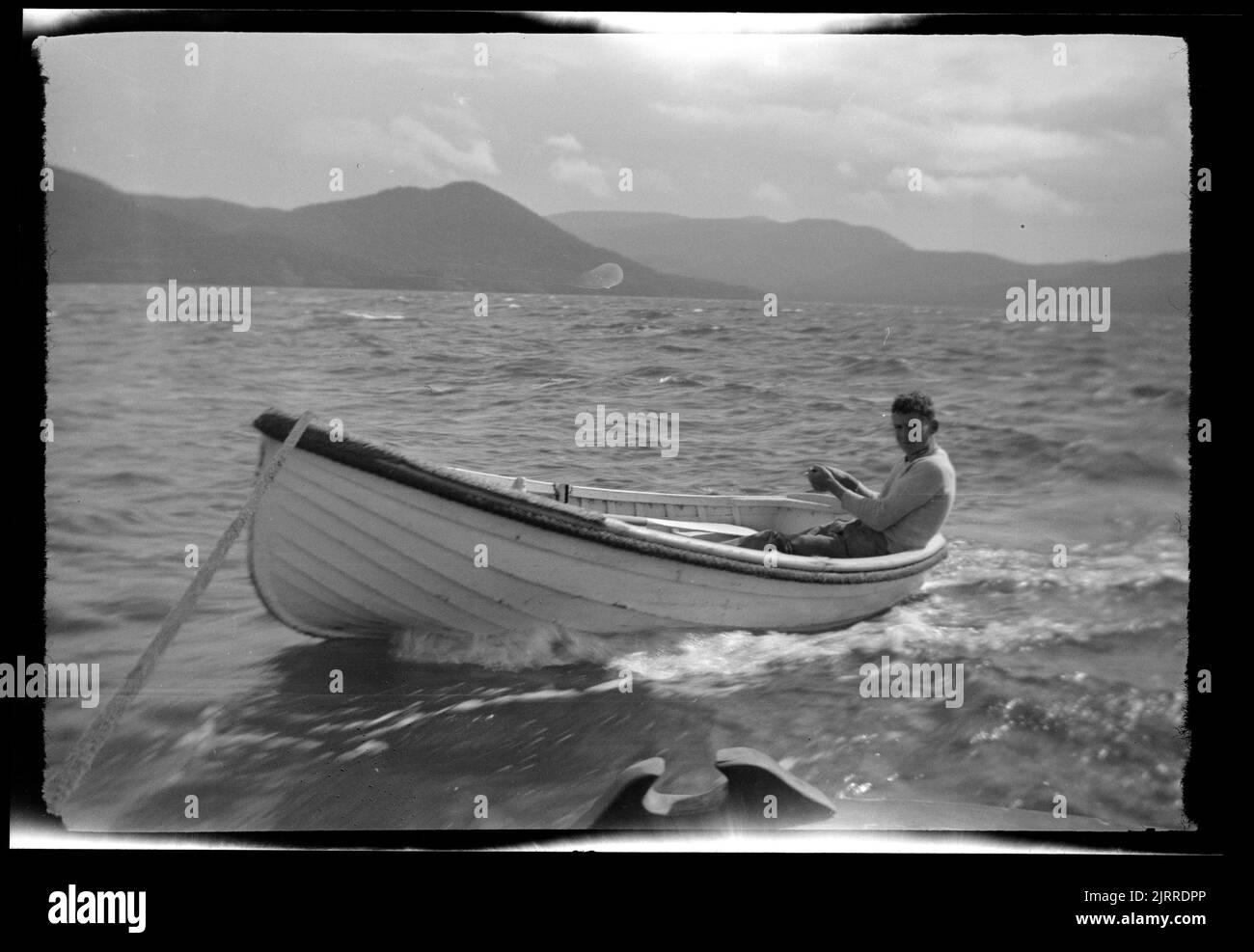 Dinghy being towed, 19361937, Stewart Island, maker unknown Stock