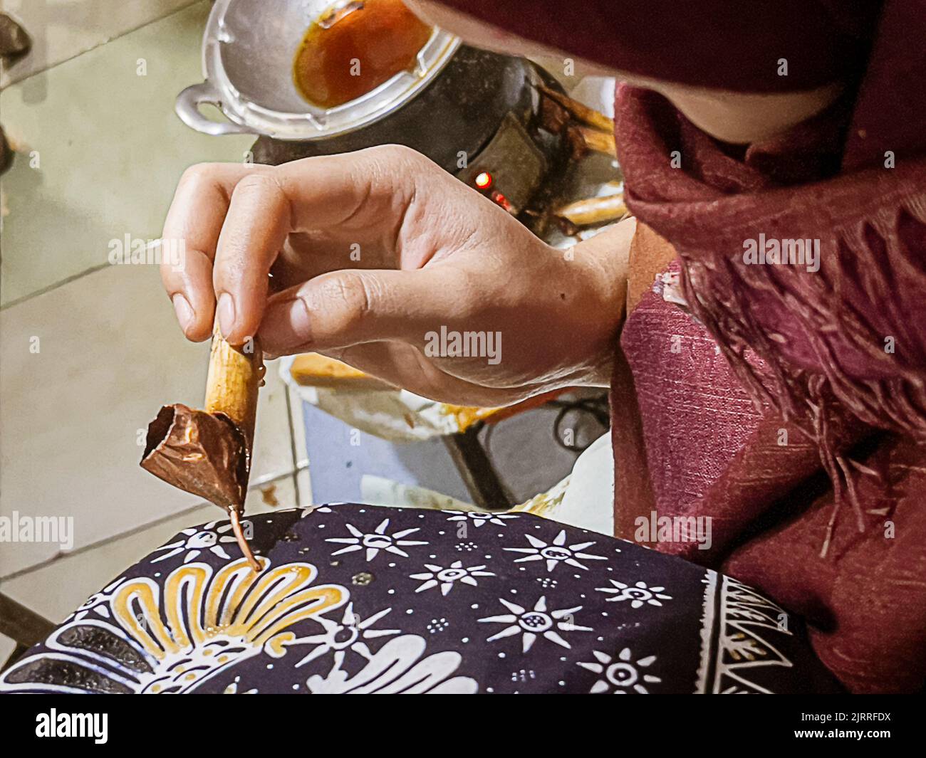 Java, Indonesia, June 13, 2022 - Batik originated in Java and is a technique of wax-resistant dye applied to the entire cloth. Stock Photo