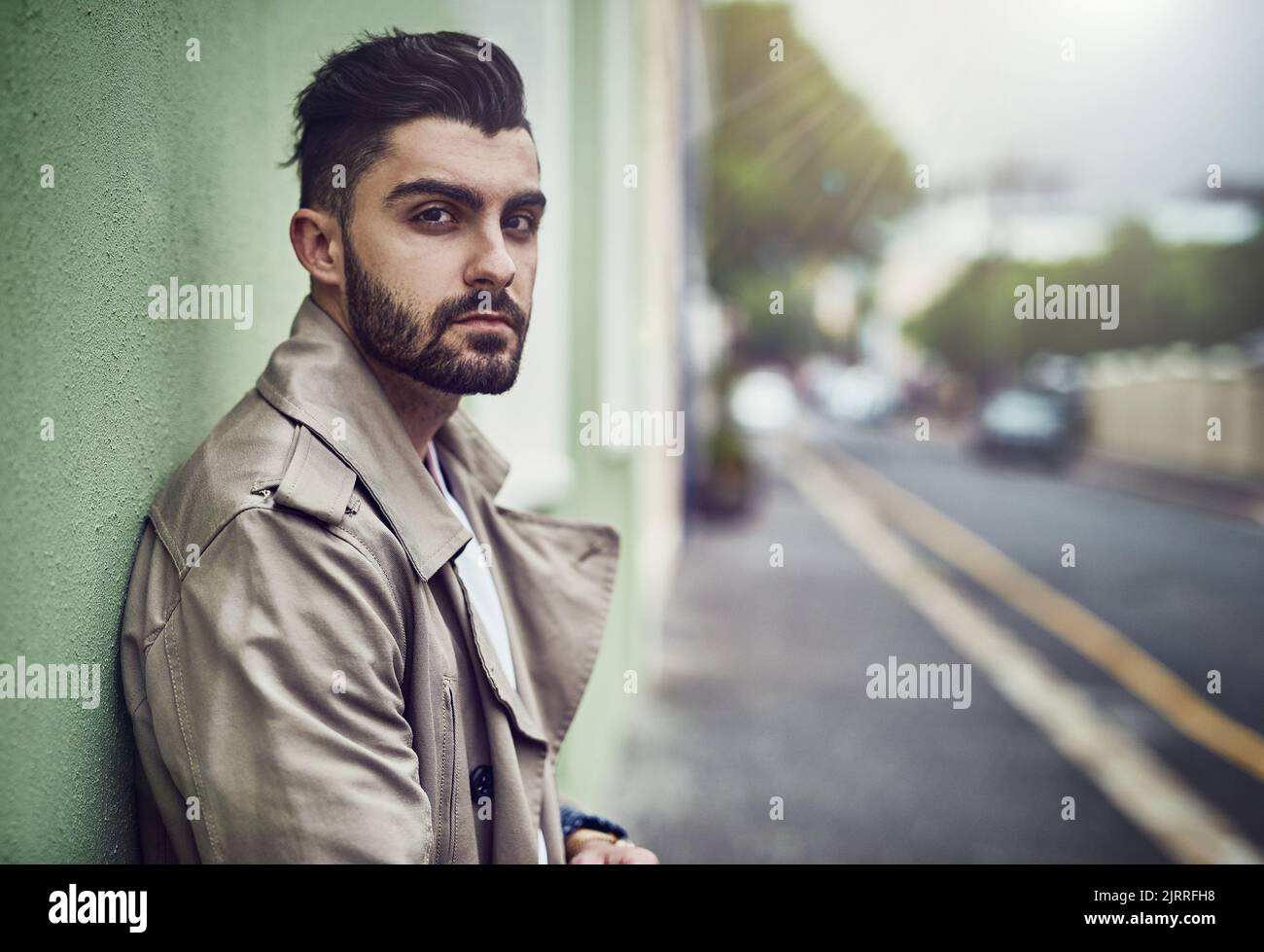Inner city styling. Portrait of a fashionable young man wearing urban wear in the city. Stock Photo