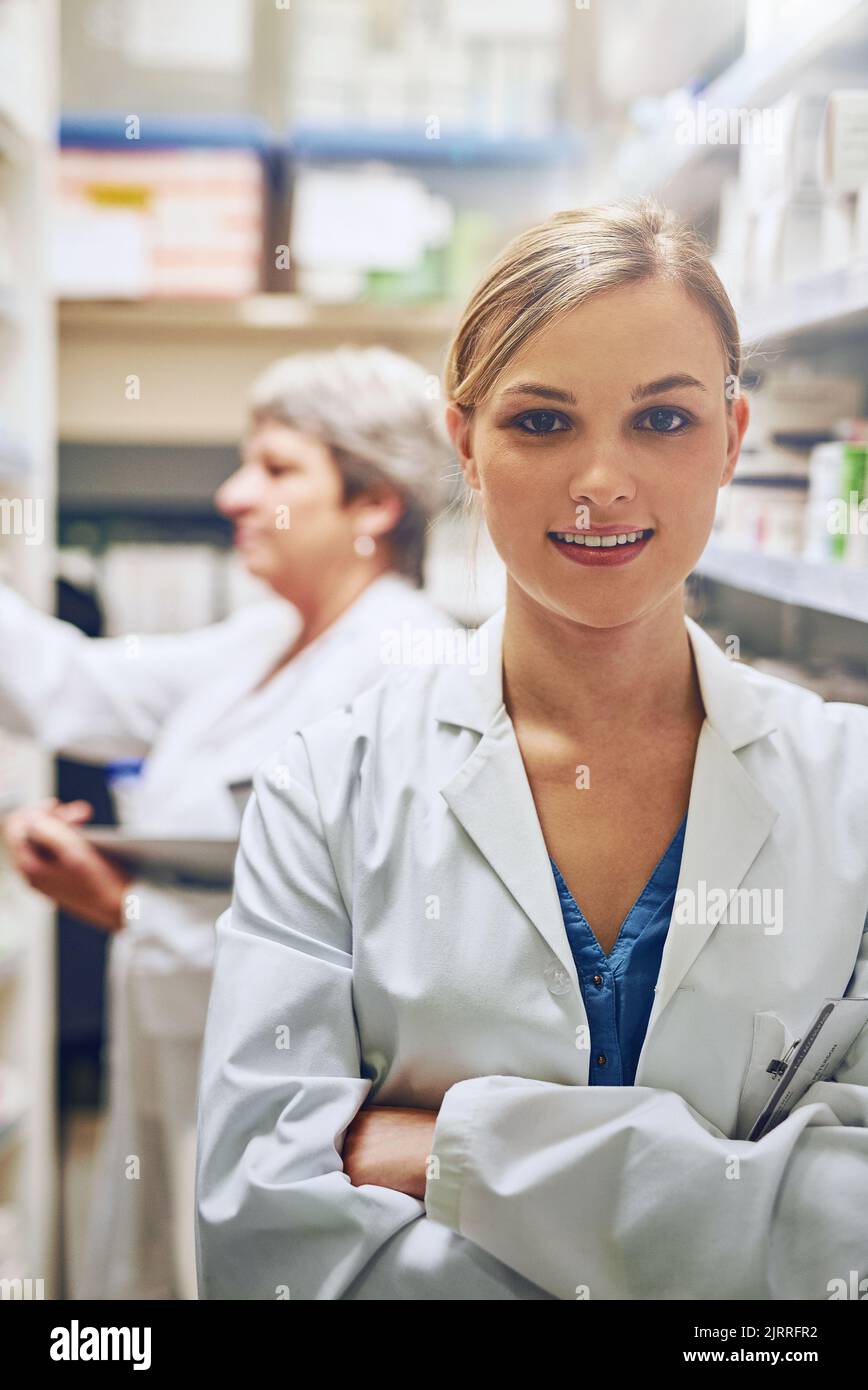 Positive young female pharmacist hi-res stock photography and images ...