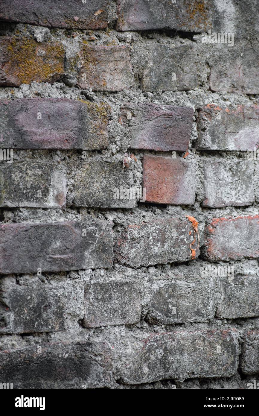 A vertical shot of old gray stone house wall surface Stock Photo - Alamy