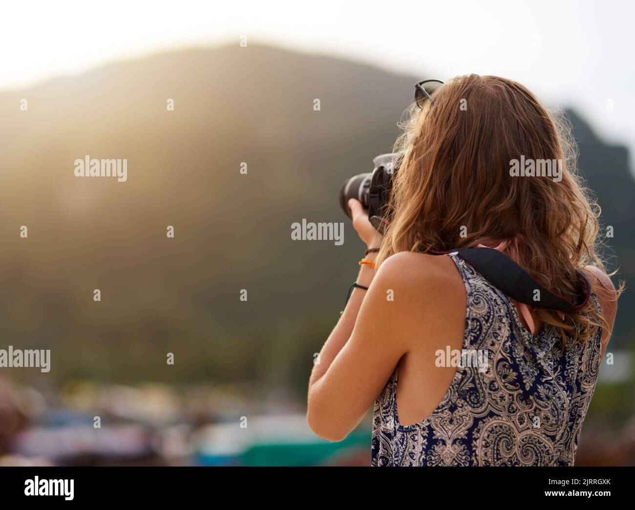 Exploring life through a lens. a young woman taking photos with her