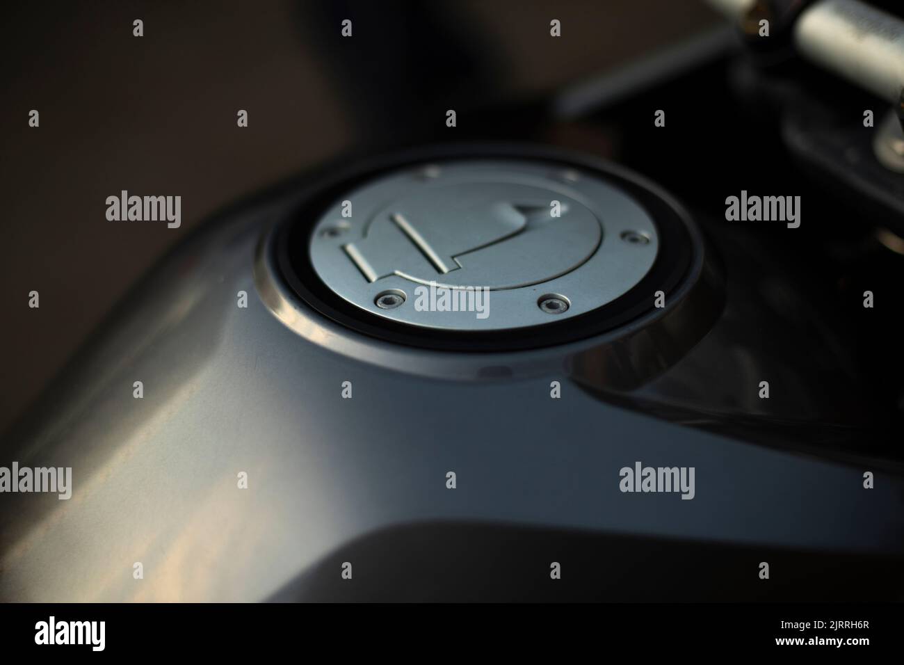 Gas tank of motorcycle. Details of bike. Cover on gas tank. Place for