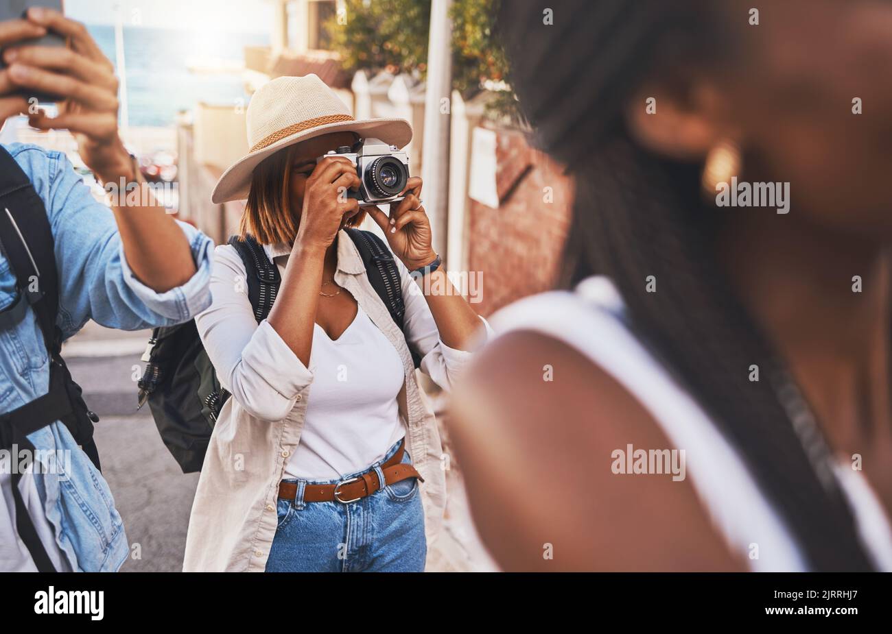 Travel, tourism and photograph with a woman tourist taking a picture while on holiday, vacation or weekend getaway. Memories, sightseeing and overseas Stock Photo