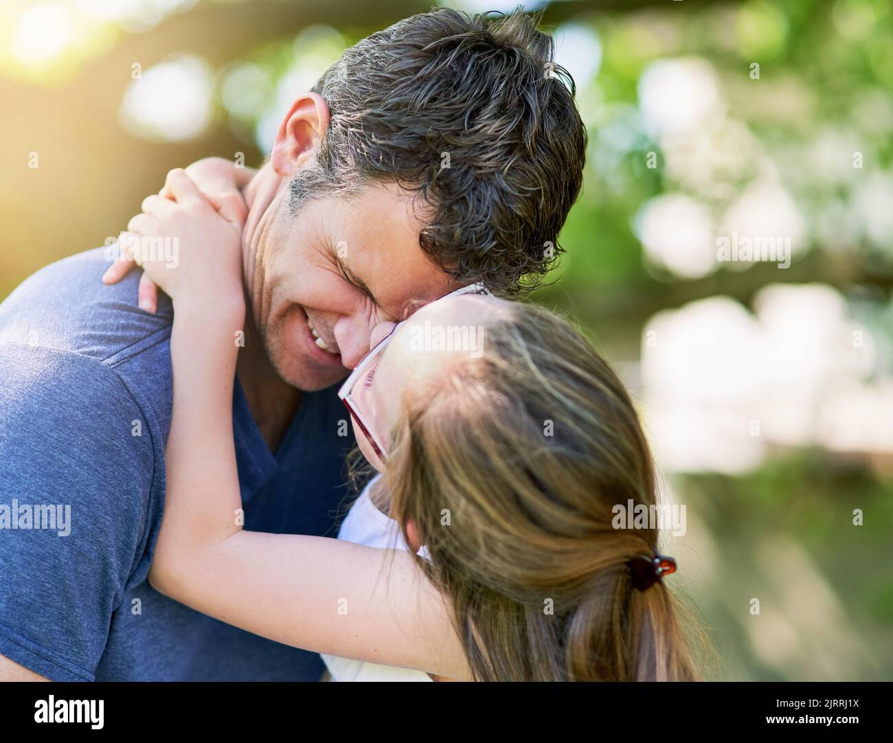 Love is such a wonderful feeling. a little girl giving her father a