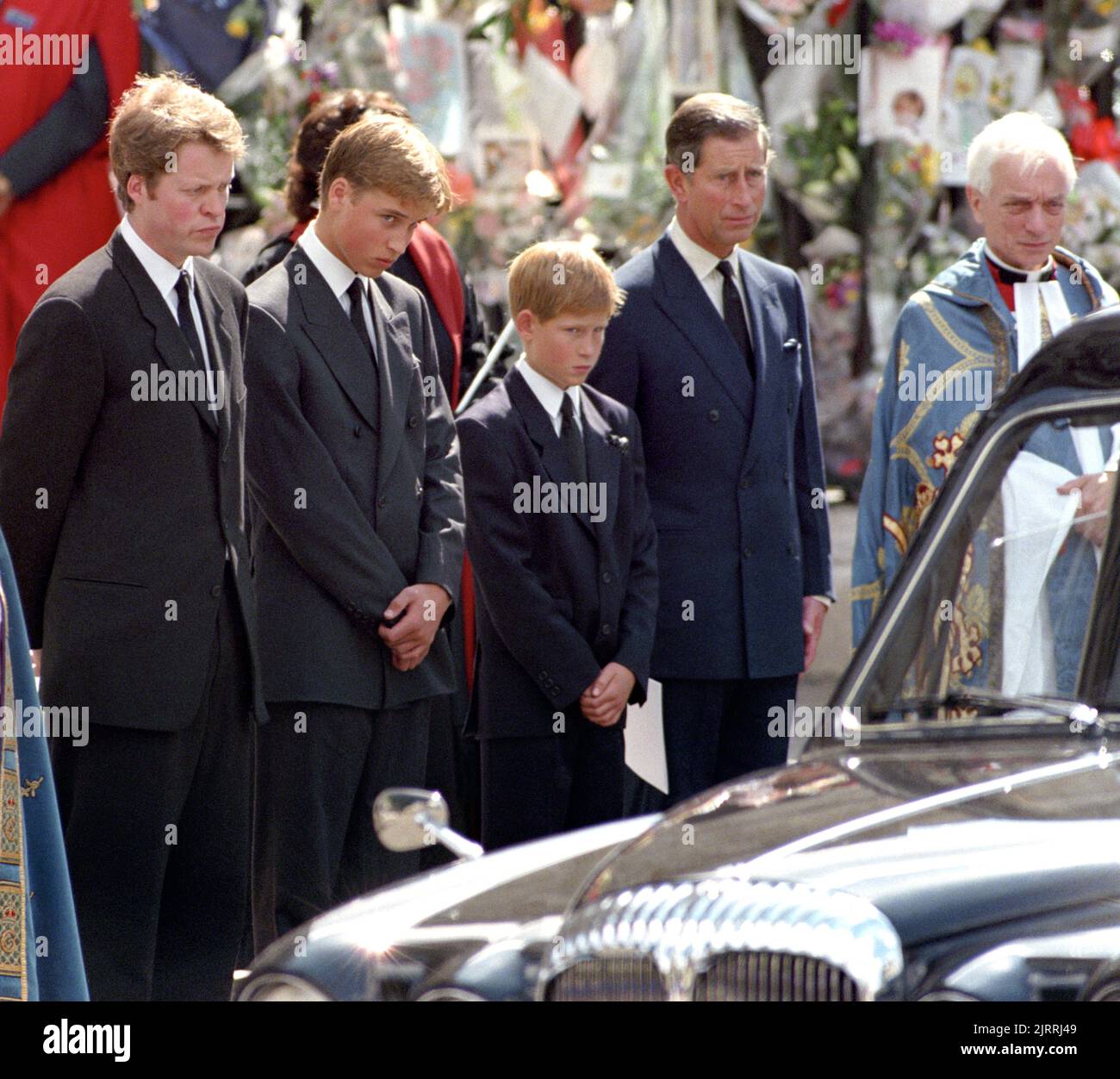 File photo dated 06/09/97 of (left-right) the Earl Spencer, Prince William, , Prince Harry, the Prince of Wales, wait as the hearse carrying the coffin of Diana, Princess of Wales prepares to leave Westminster Abbey in London, following her funeral service. Diana, Princess of Wales, was killed on August 31 1997 in a car crash in the Pont de l'Alma tunnel in Paris. Issue date: Friday August 26, 2022. Stock Photo