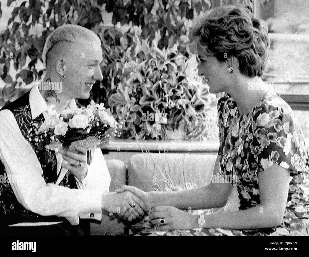File photo dated 20/07/92 of Diana, Princess of Wales shaking hands with William Drake, a patient at the London Lighthouse Aids Centre. The Princess of Wales was killed on August 31 1997 in a car crash in the Pont de l'Alma tunnel in Paris. Issue date: Friday August 26, 2022. Stock Photo