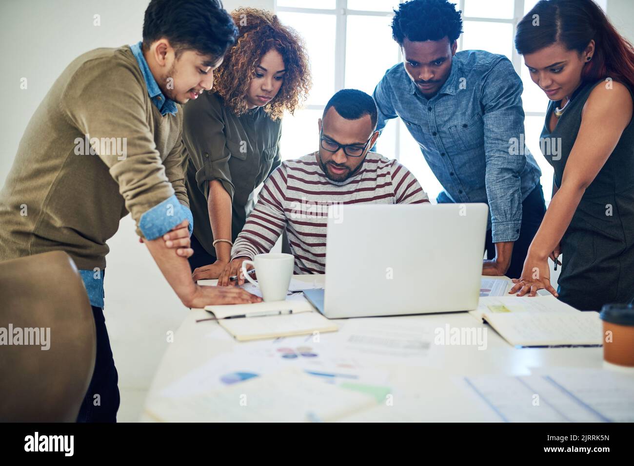 Creative collaboration at its best. a group of colleagues using a ...