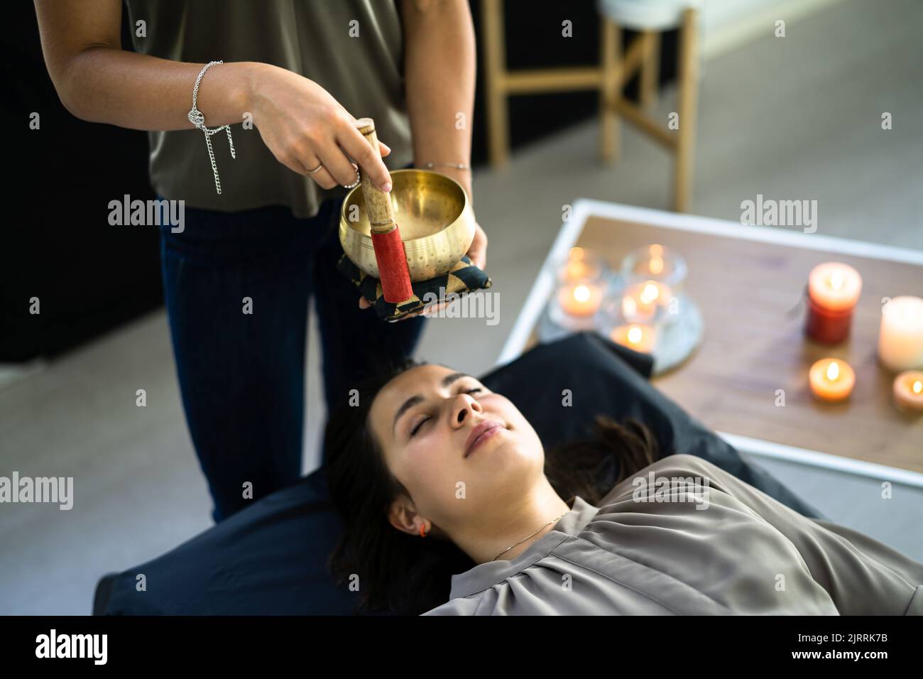 Tibetan Meditation And Relaxation Therapy. Traditional Healing Bowl Care Stock Photo