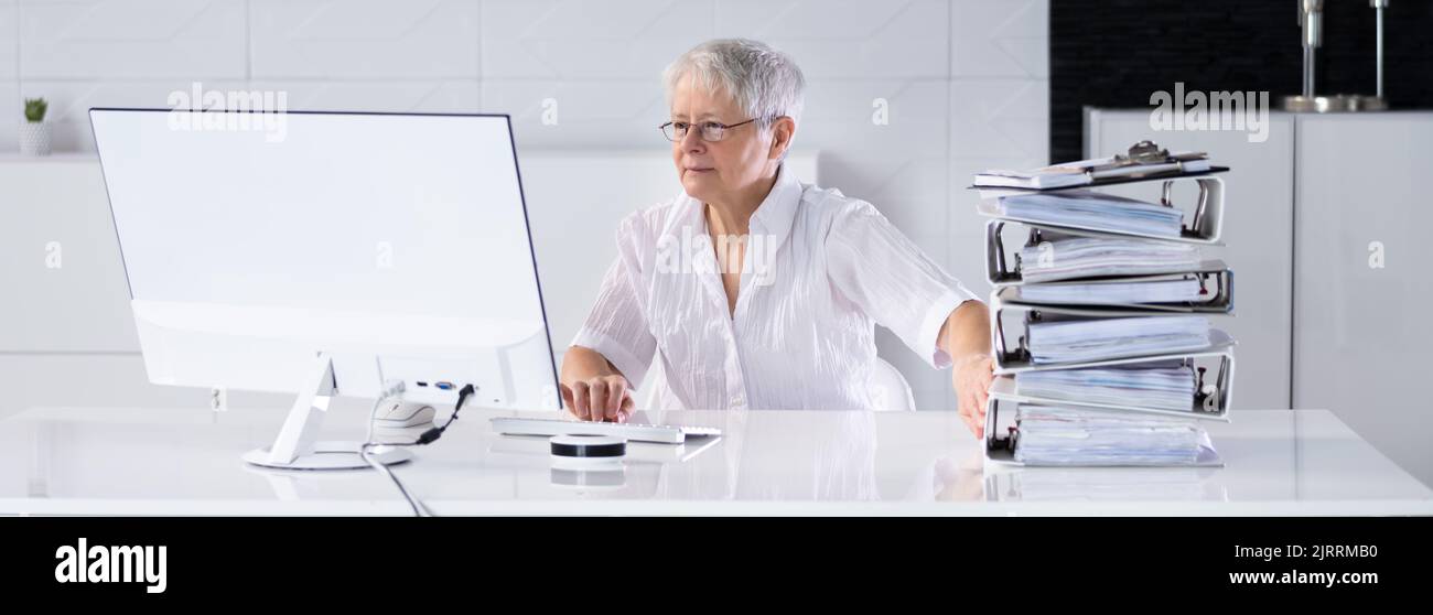 Digital Transformation. Accountant Using E Invoice Tax Document Software Stock Photo